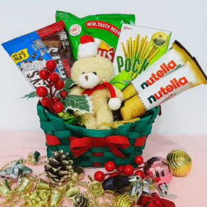 Christmas red basket with chocolates, wafer biscuits, and a mini teddy bear